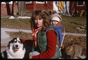 Judie, baby Phoebe (in backpack), Schuman the dog, and cat, Montague Farm Commune
