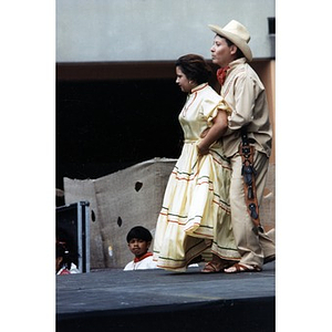 Couple performing a traditional folk dance on the outdoor stage at Festival Betances.