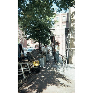 Volunteers cleaning up the area around the Jorge Hernandez Cultural Center.