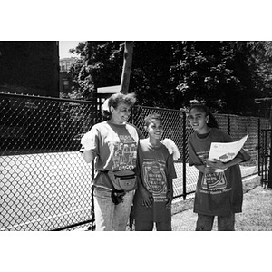 Woman poses with two Boston Youth Clean-Up Corps members.