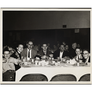 Boys' Club members seated around a table at an awards event