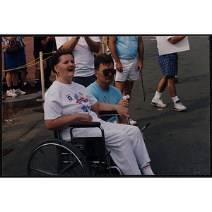 A woman and a man watch the Bunker Hill Road Race