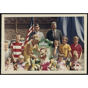 The Little Sister Contest winners posing with their brothers and the judges, including Thomas E. Goode, on the right in back