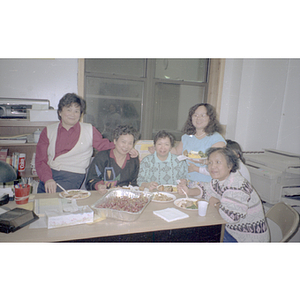 Guests eating during a Chinese Progressive Association anniversary event