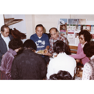 Chinese Progressive Association members eating at a community dinner