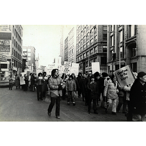 Demonstrators march through Boston opposing the New England Medical Center's Nutrition Center