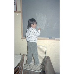 Child at a Chinese Progressive Association anniversary event