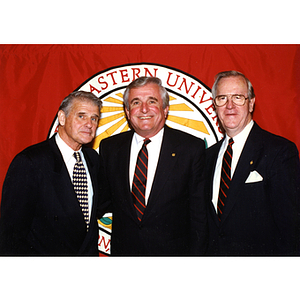 John A. Curry, left, Richard A. Ollen, and George J. Matthews, right, at an annual Board of Trustees meeting