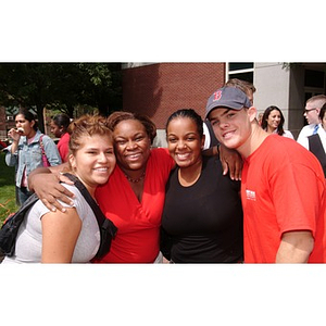 Three Torch Scholars pose with Angelique Anderson at the President's barbecue