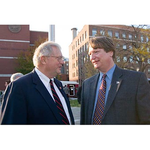 Neal Finnegan stands with another man at the Veterans Memorial dedication ceremony