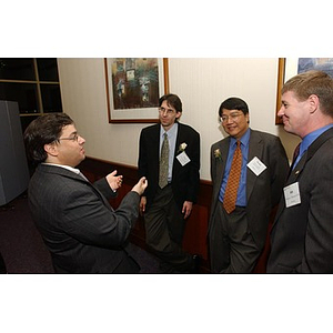 Dr. Homer Pien and three men at The National Council Dinner