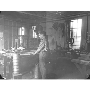 An engineering student works in shop