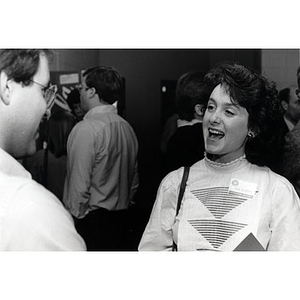 A man and woman speaking at the Law School Open House, 1985