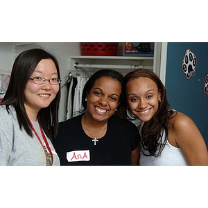 Torch Scholars Qinrui Pang, Ana Hidalgo, and Melanie Arvajo pose together during move-in