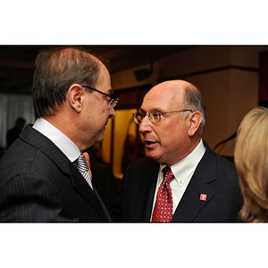 Sy Sternberg speaking to President Aoun during NU Night at the Pops