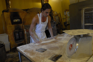 Hungry Ghost Bread: baker Jonathan C. Stevens rolling out bread dough