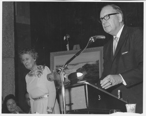 Warren Pierce McGuirk, standing at podium