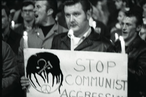 Young Americans for Freedom pro-Vietnam War demonstration, Boston Common: Man holding sign reading "Stop Communist aggression"