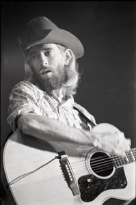 New Riders of the Purple Sage opening for the Grateful Dead at Sargent Gym, Boston University: John 'Marmaduke' Dawson playing acoustic guitar