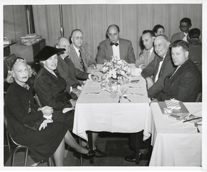 Mary Switzer sits with a group at a luncheon in her honor at the Institute for the Crippled and Disabled