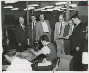 Attendees at a joint meeting of the American society of tool engineers and ICD touring a workshop