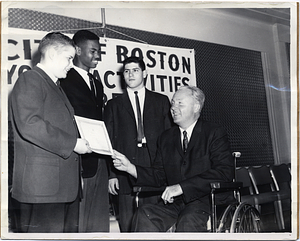 Mayor John F. Collins recognizing three young men