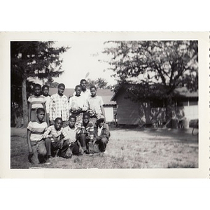 A group of boys pose in front of cabins at Breezy Meadows Camp