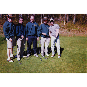 A five-men golf team posing with their clubs at the Charlestown Boys and Girls Club Annual Golf Tournament