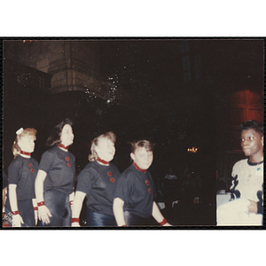 Four girls wearing uniforms and standing in a line at the "Recognition Dinner at Harvard Club"