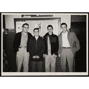 Four teenage boys pose for a group photo