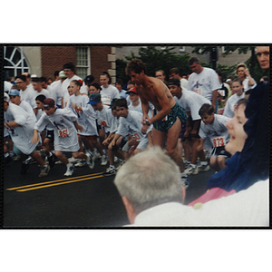 Children and adults leave the start line at the Battle of Bunker Hill Road Race