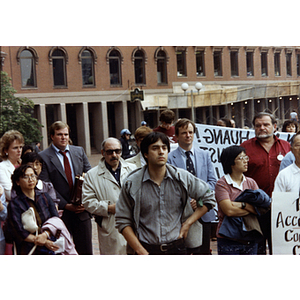 Chinese American protesters and concerned citizens rally for Long Guang Huang in City Hall Plaza in Boston