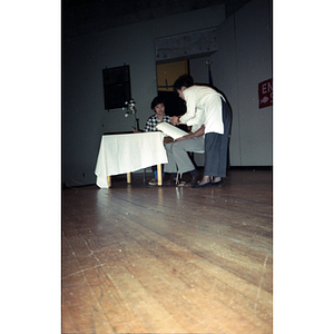 People talking at a voter registration event