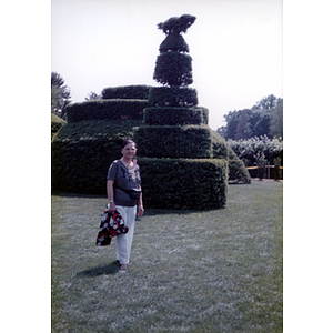 Woman stands in a topiary garden in the Longwood Gardens of Philadelphia