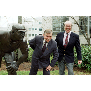 Lech Walesa and Dean Robert Lowndes pose with Cy Young statue
