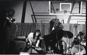 Unidentified band in performance in what appears to be a high school gymnasium