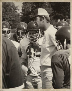 Coach Vandersea during a huddle (c. 1976-1984)