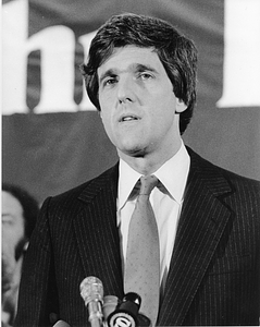 Senator John Kerry at a microphone