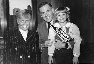 Mayor Raymond L. Flynn with his wife Catherine (Kathy) and unidentified girl wearing March of Dimes banner