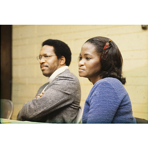 Man and woman listening during a meeting