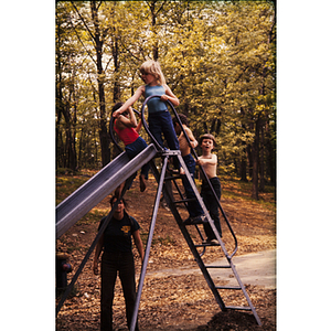 Children playing on playground slide