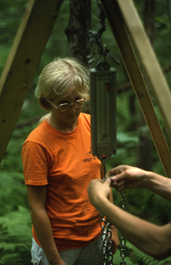 Meg Lowman (Class of 1976) checking field scale used in the NSF-URP paper birch biomass and productivity study.