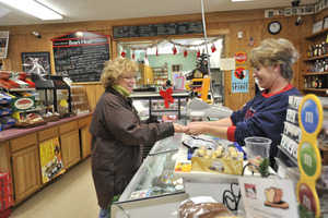 Sales transaction at the counter, New Salem General Store