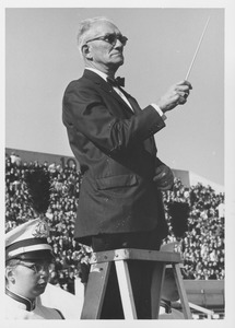 Unidentified man conducting the University of Massachusetts marching band