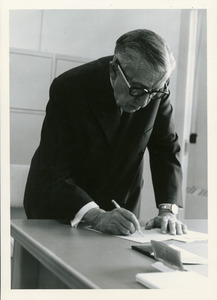 Frank L. Boyden marking paper