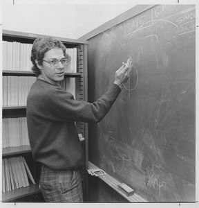 Joseph H. Taylor, UMass Amherst Professor of Physics and Astronomy, standing at a blackboard