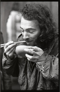 Vietnam Veterans Against the War demonstration 'Search and destroy': veteran eating from a bowl with chopsticks