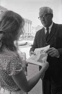 Boston Phoenix promotional photos: Phoenix hawker handing paper to man