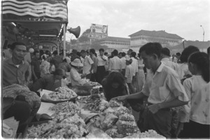 Scenes of buying spree and carnival atmosphere at Saigon Central Market.