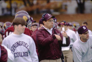 Football Players and Head SC Coach Mike Delong on the sidelines